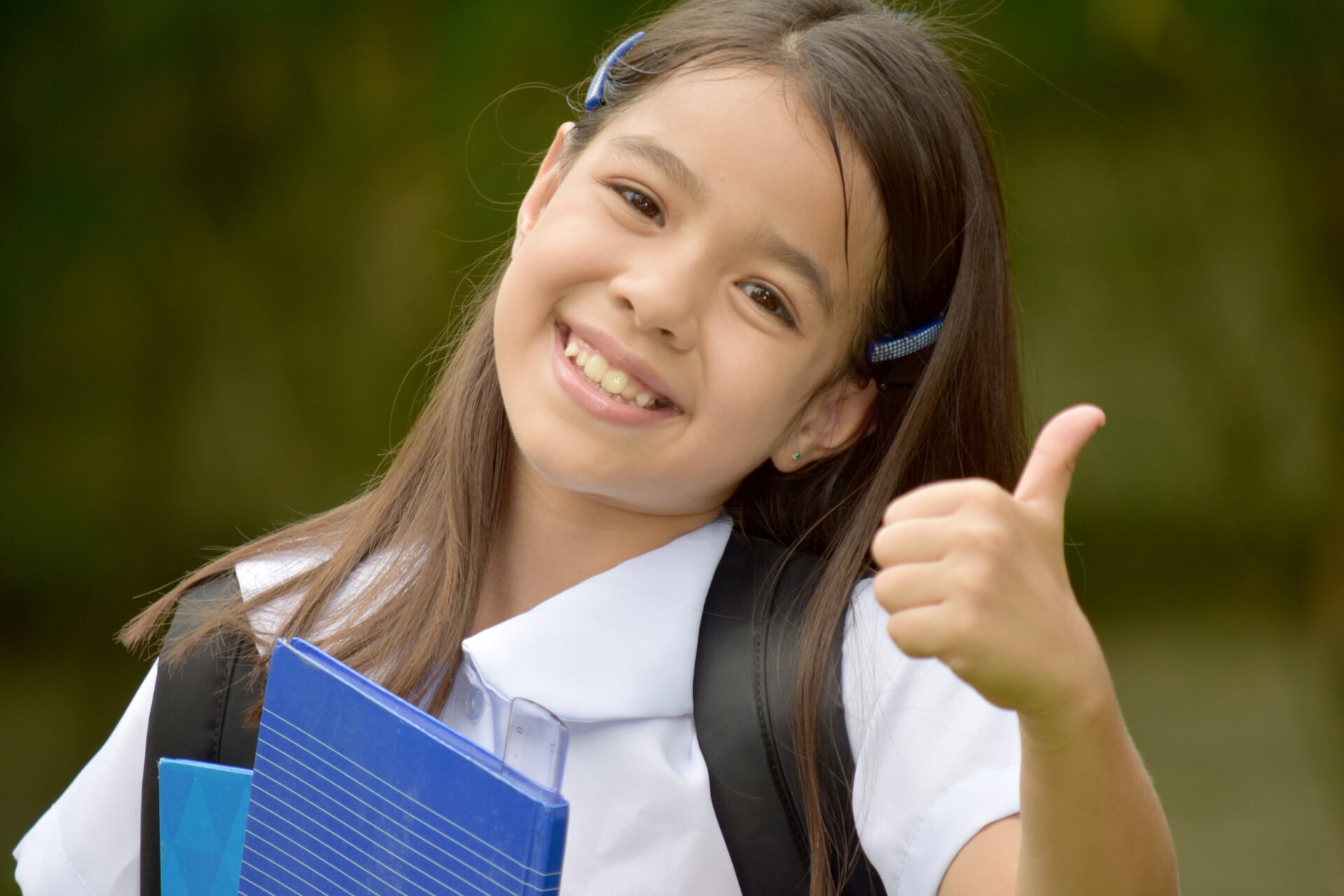 Happy Catholic Minority Girl Student With Books